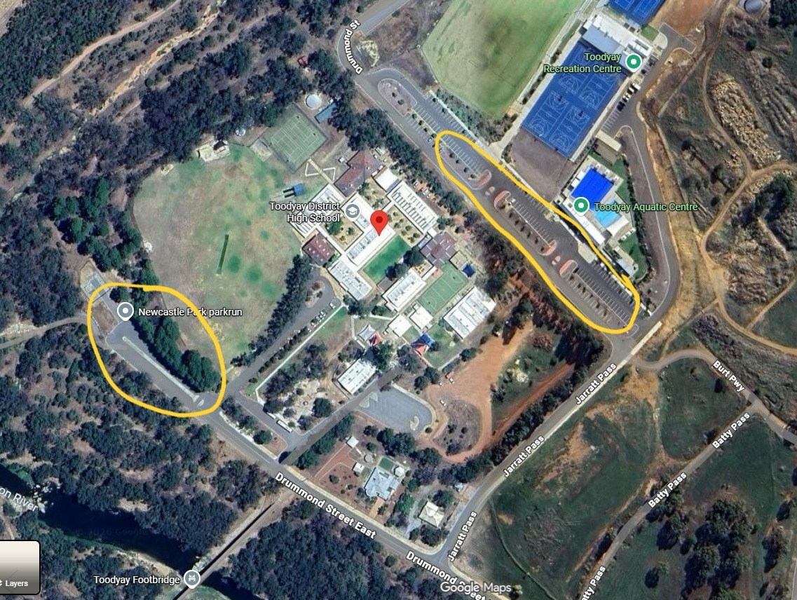 Parking areas highlighted in yellow at the front and rear side of TDHS.